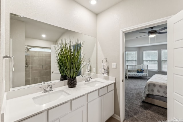 bathroom featuring vanity and ceiling fan