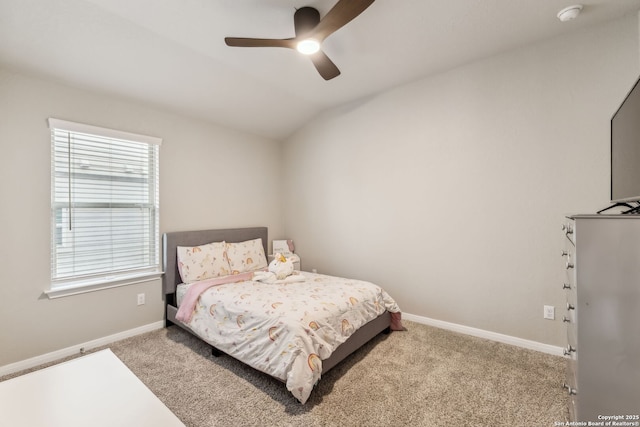 bedroom with lofted ceiling, light carpet, and ceiling fan