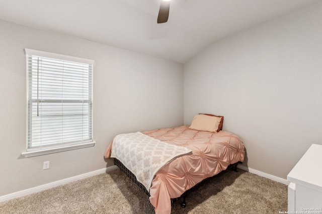 bedroom featuring vaulted ceiling, carpet, and ceiling fan