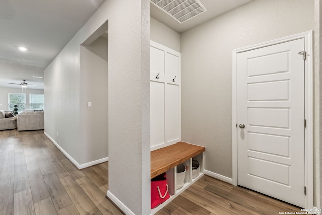 mudroom with ceiling fan and light hardwood / wood-style flooring