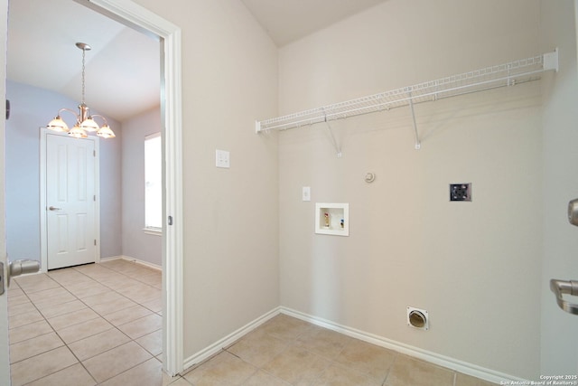 laundry area with hookup for a gas dryer, hookup for an electric dryer, and light tile patterned flooring