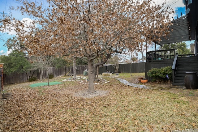 view of yard with a wooden deck