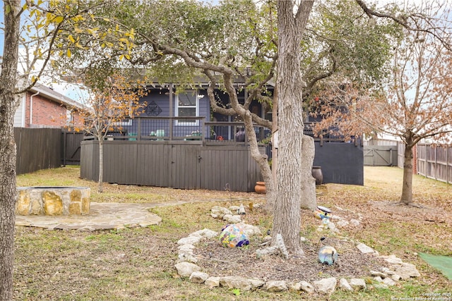 view of yard featuring a wooden deck