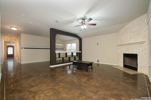 living room with lofted ceiling, a stone fireplace, and ceiling fan