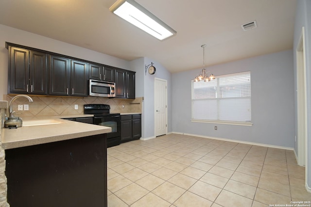 kitchen with vaulted ceiling, decorative light fixtures, sink, backsplash, and black range with electric cooktop