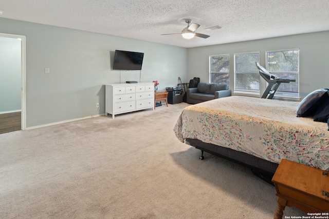 bedroom with light carpet, a textured ceiling, and ceiling fan