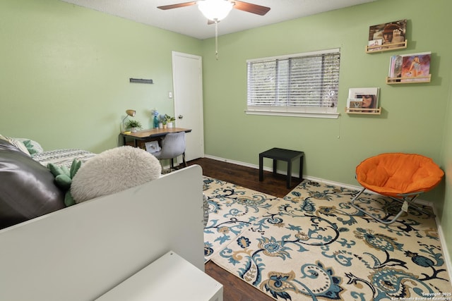 interior space featuring wood-type flooring and ceiling fan