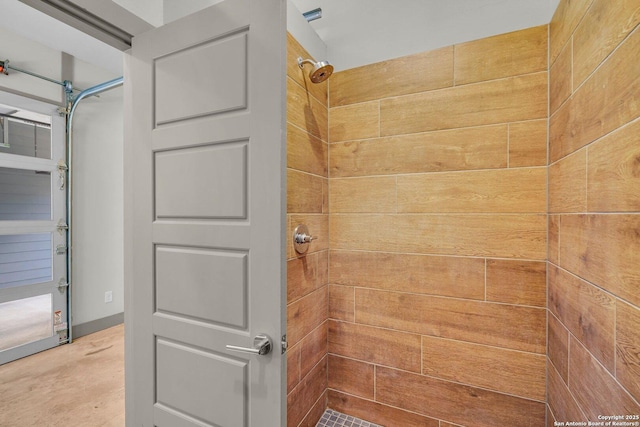 bathroom featuring concrete floors and a shower