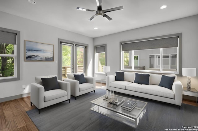 living room with ceiling fan and dark hardwood / wood-style floors