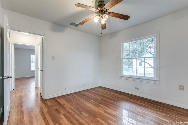 unfurnished room featuring hardwood / wood-style flooring and ceiling fan