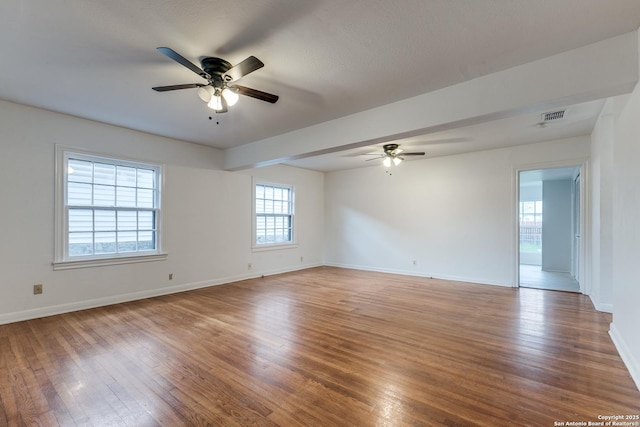 empty room featuring hardwood / wood-style flooring and ceiling fan