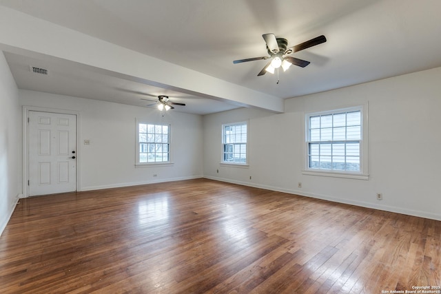 spare room featuring wood-type flooring and ceiling fan