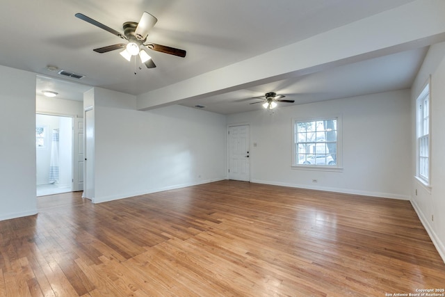 empty room featuring ceiling fan and light wood-type flooring