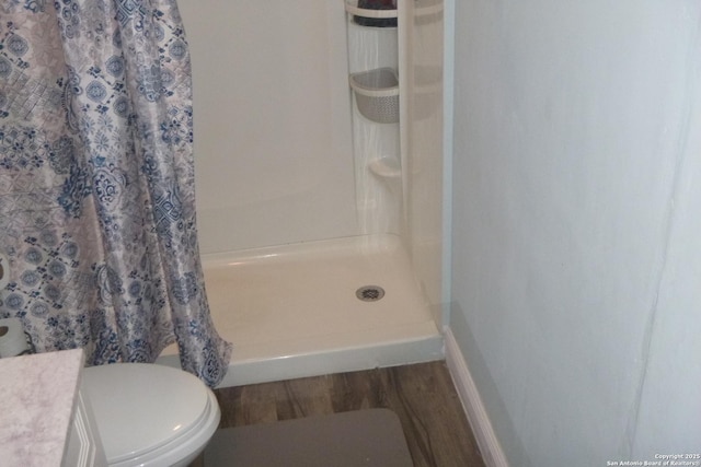 bathroom featuring vanity, hardwood / wood-style floors, a shower with curtain, and toilet