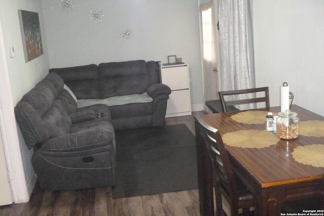 dining space featuring hardwood / wood-style flooring