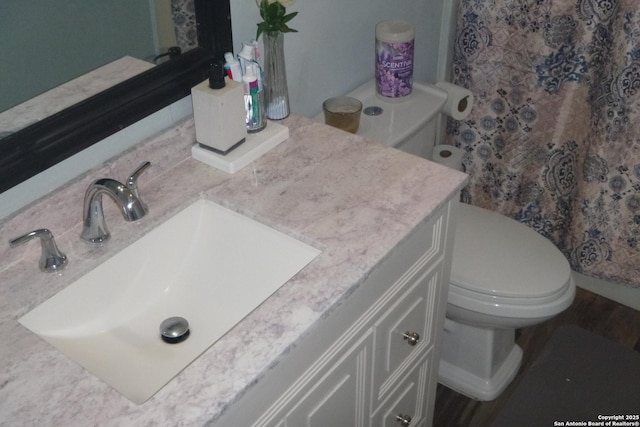 bathroom with vanity and toilet