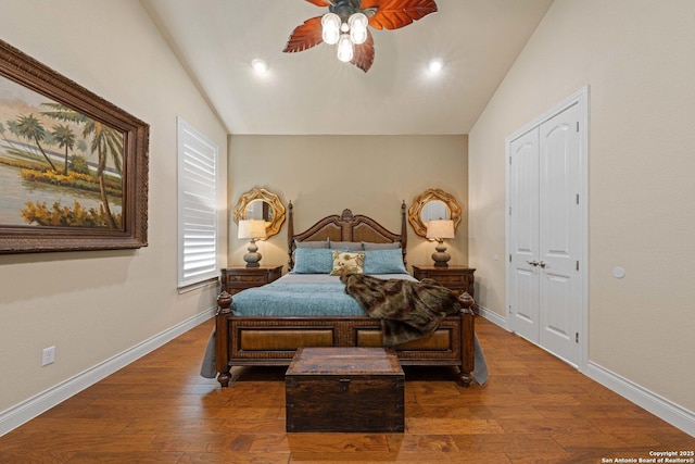 bedroom featuring lofted ceiling, dark wood-type flooring, and ceiling fan