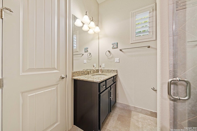 bathroom with walk in shower and vanity