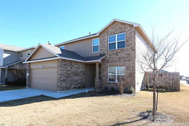 view of property with a garage and a front yard