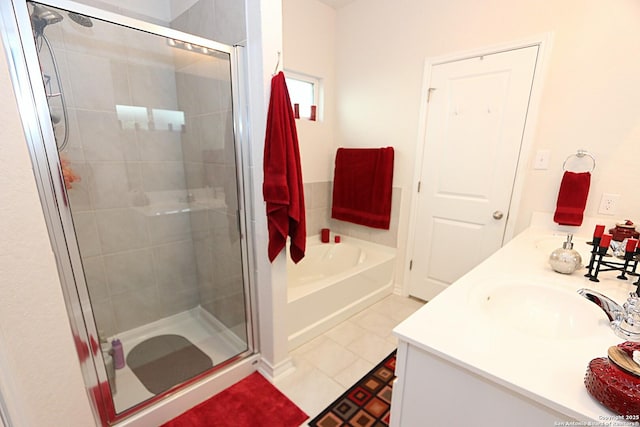 bathroom featuring vanity, independent shower and bath, and tile patterned flooring