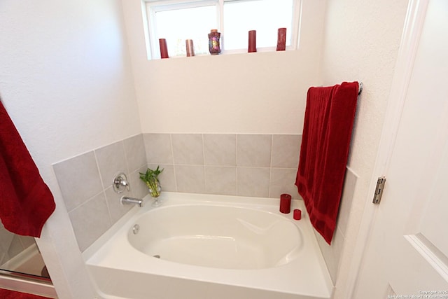 bathroom with a tub to relax in