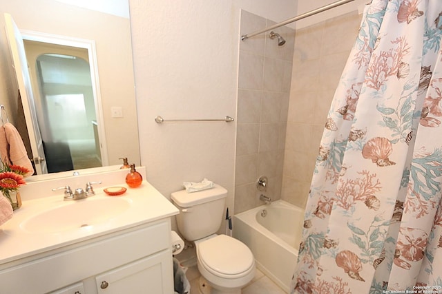 full bathroom with shower / bath combination with curtain, vanity, and toilet