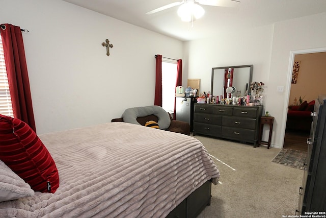 bedroom with light colored carpet and ceiling fan