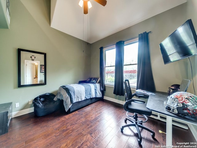 bedroom with lofted ceiling, dark wood-type flooring, and ceiling fan