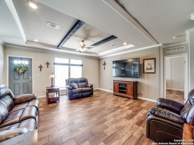 living room with a raised ceiling, crown molding, ceiling fan, and light hardwood / wood-style flooring