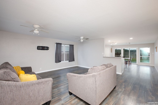 living room with dark hardwood / wood-style floors and ceiling fan