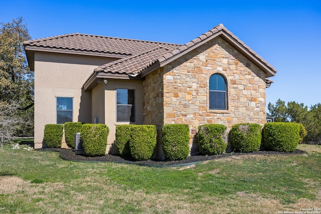 view of property exterior featuring a yard