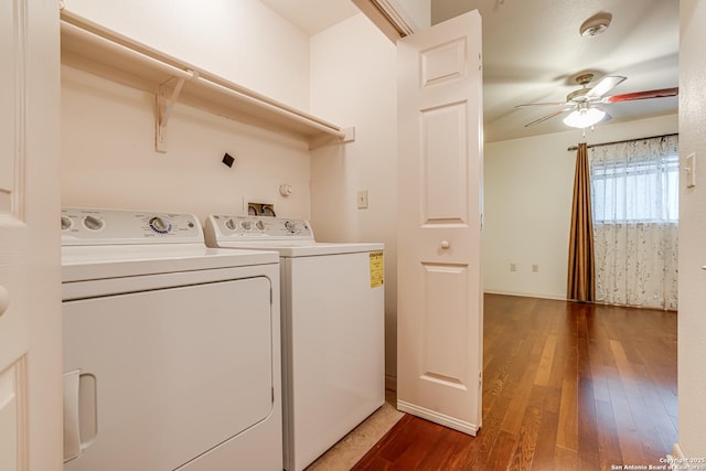 washroom with ceiling fan, washing machine and clothes dryer, and dark hardwood / wood-style flooring