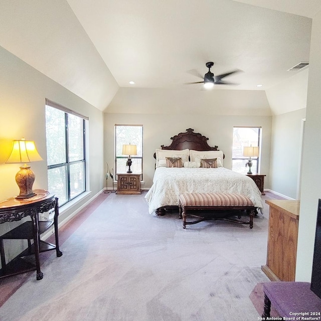 bedroom with light carpet, vaulted ceiling, and ceiling fan