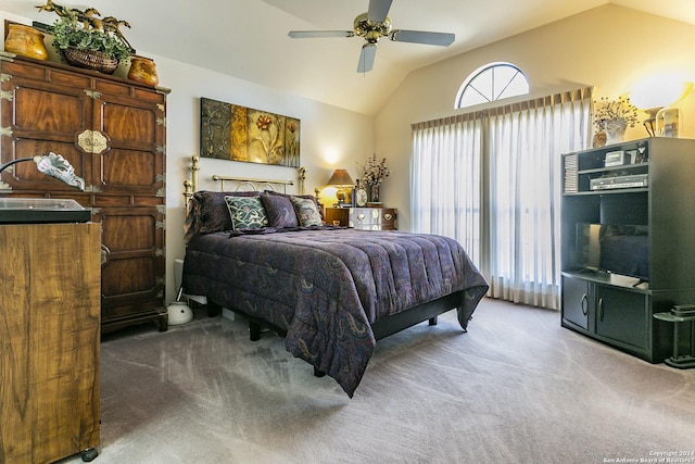 bedroom featuring ceiling fan, vaulted ceiling, and carpet