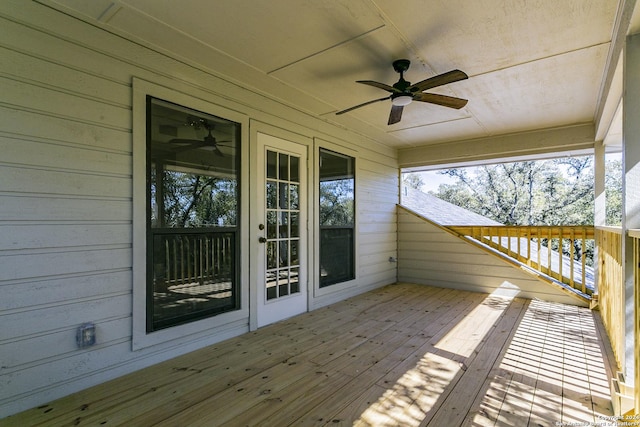 wooden terrace featuring ceiling fan