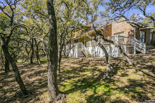 view of home's exterior featuring a wooden deck