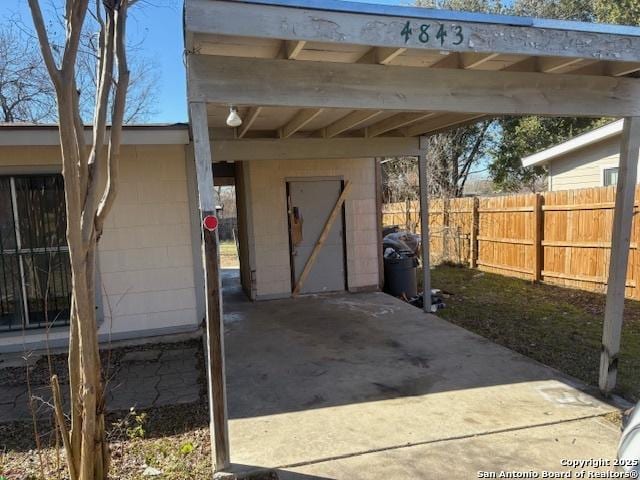 view of outdoor structure with a carport