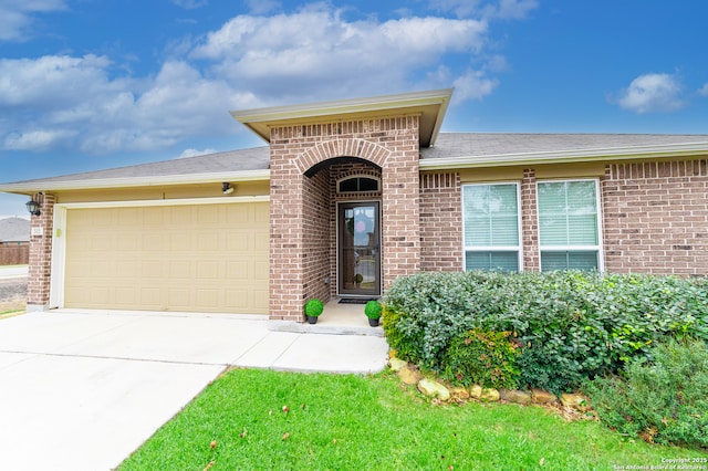 view of front of property with a garage