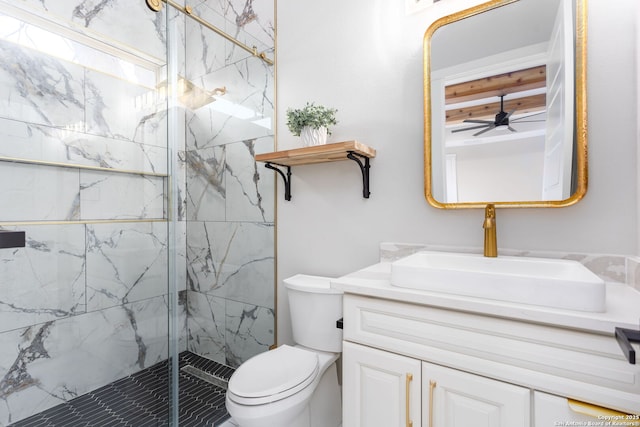 bathroom featuring walk in shower, ceiling fan, vanity, and toilet