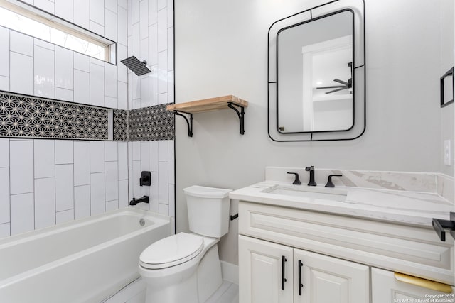 full bathroom with vanity, toilet, and tiled shower / bath combo