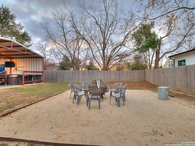 exterior space featuring a patio and a fire pit