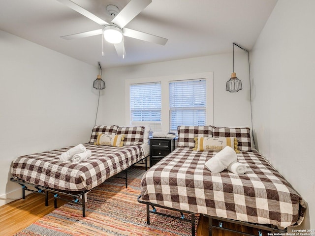 337 W Hackberry St, Fredericksburg, TX 78624 - bedroom featuring ceiling fan and hardwood / wood-style floors