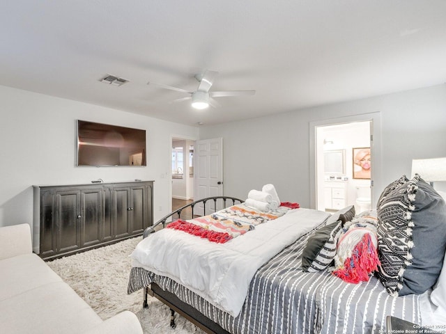 337 W Hackberry St, Fredericksburg, TX 78624 - bedroom with ceiling fan and ensuite bathroom