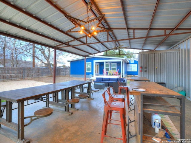 337 W Hackberry St, Fredericksburg, TX 78624 - dining room featuring vaulted ceiling and concrete floors