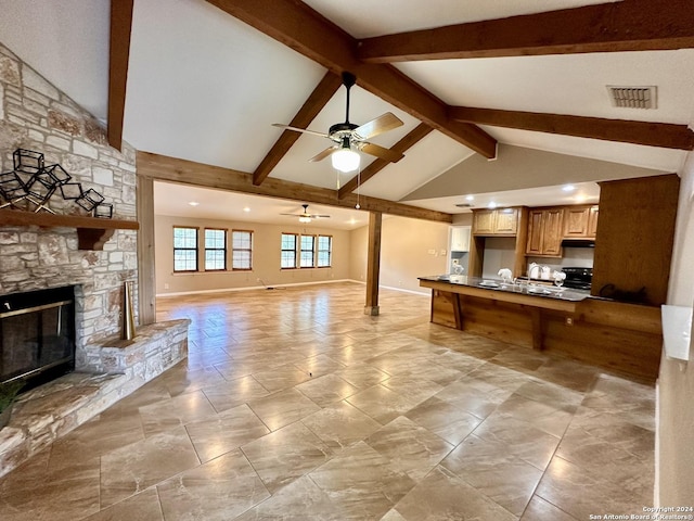 living room with ceiling fan, a fireplace, high vaulted ceiling, and beam ceiling