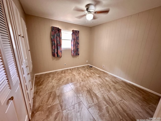 unfurnished bedroom featuring ceiling fan