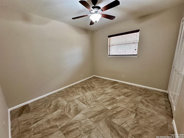 unfurnished room featuring ceiling fan