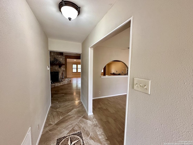 hall with wood-type flooring