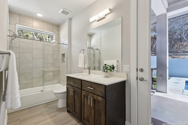 full bathroom with vanity, toilet, and combined bath / shower with glass door