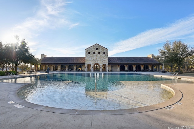 view of pool featuring a patio